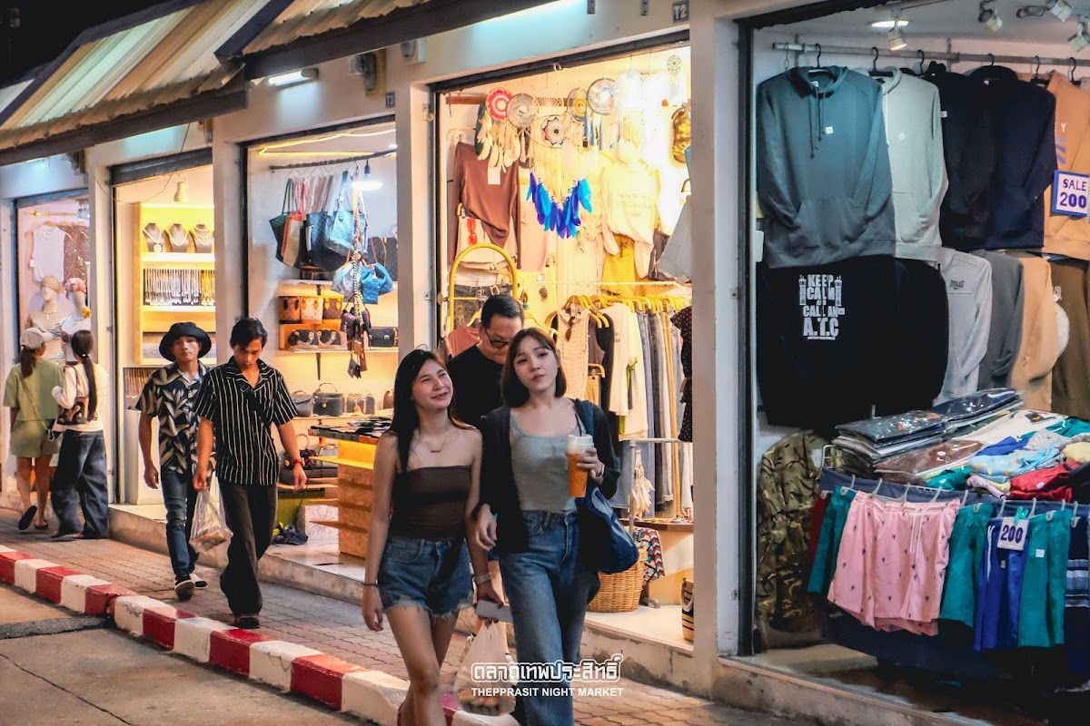 Colorful stalls at Pattaya night market with Thai street food