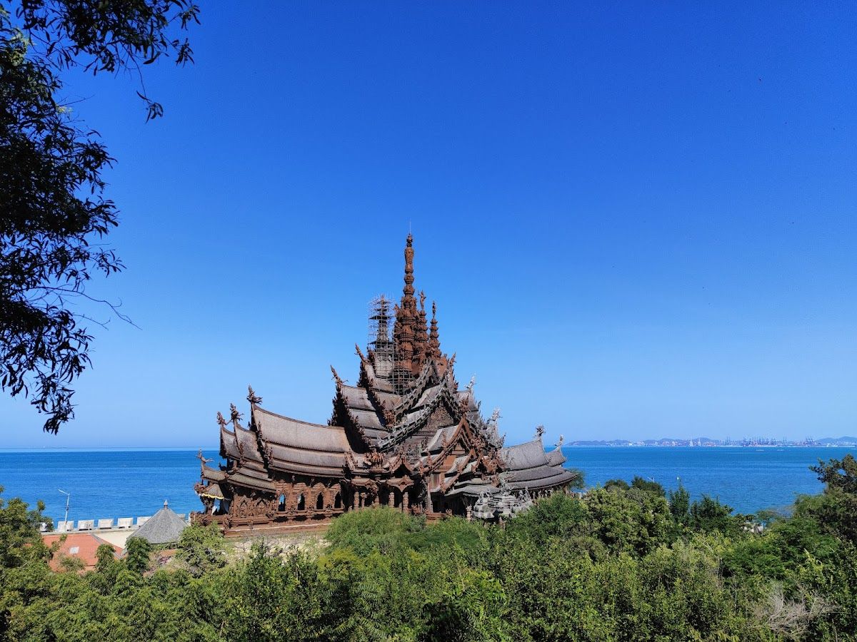 Sanctuary of Truth Pattaya towering teak wood temple at sunset