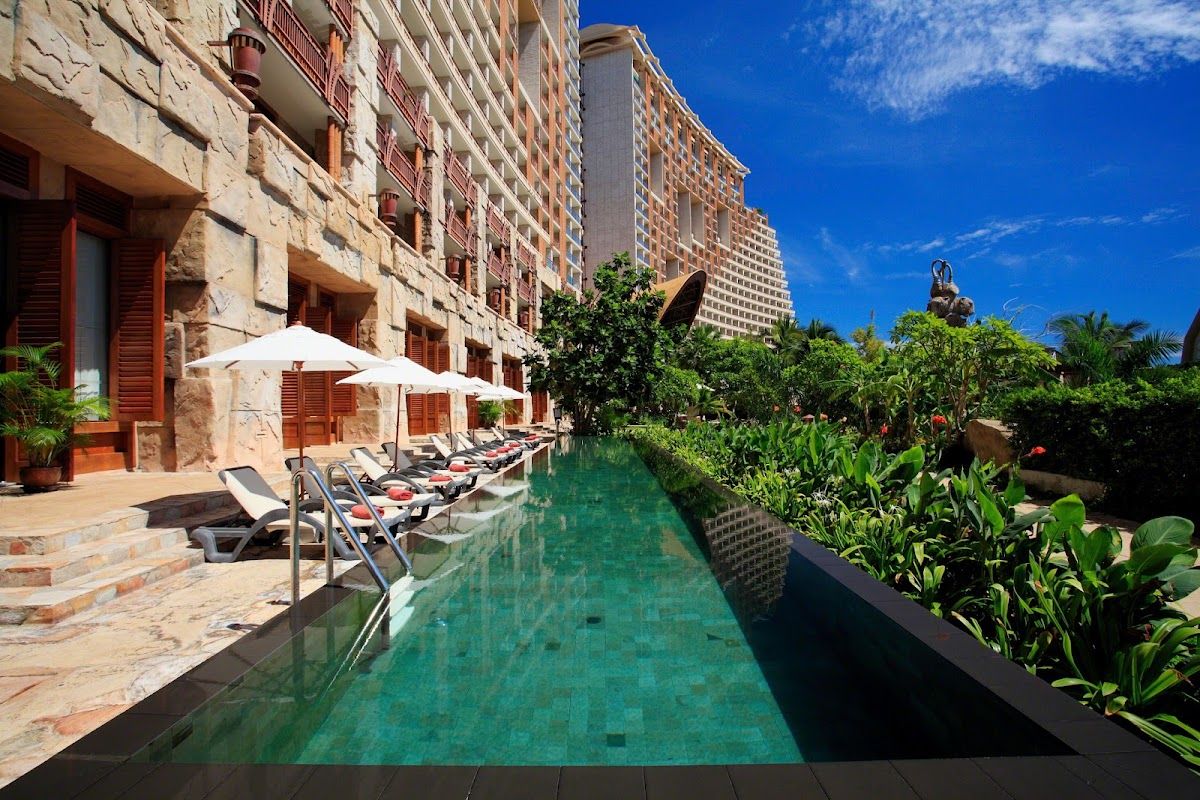 Centara Grand Mirage Beach Resort Pattaya pool area with lush tropical gardens and the resort's Lost World themed architecture