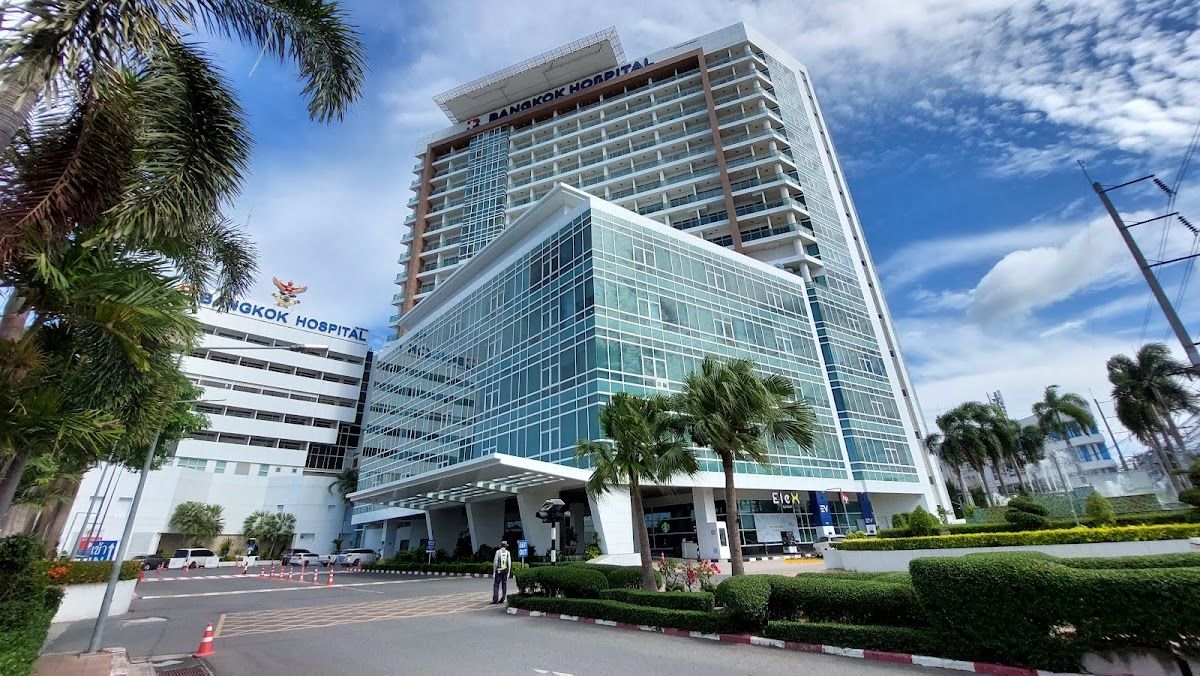 The reception area of Doctor Smile Dental Clinic in South Pattaya, showing the clinic's desk and Doctor Smile branding