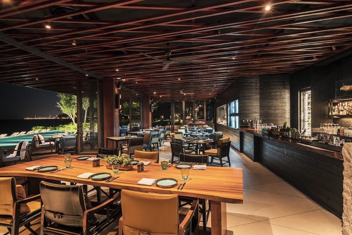 Rimpa Lapin restaurant Pattaya with multi-level terrace dining overlooking the Gulf of Thailand at sunset