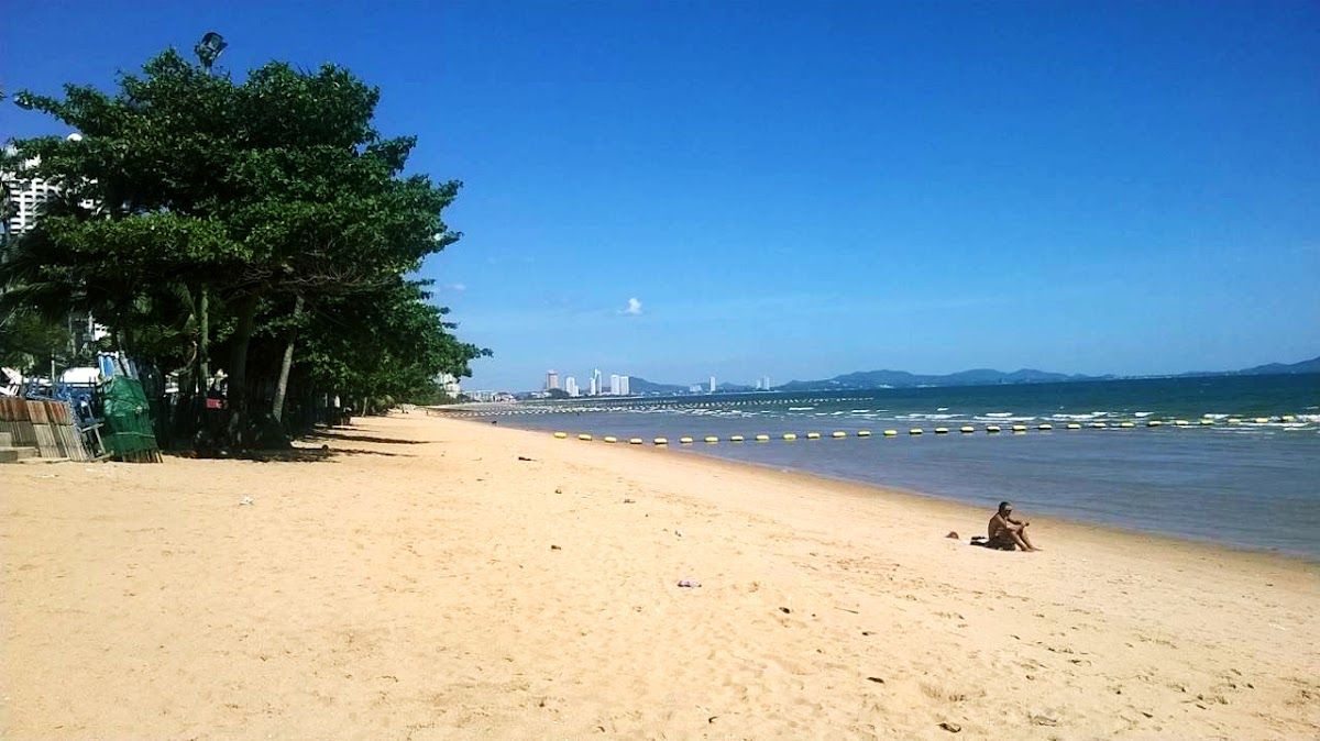 Jomtien Beach — a wide, quiet stretch of sand 5km south of central Pattaya, almost empty in the morning, with the city skyline visible in the distance
