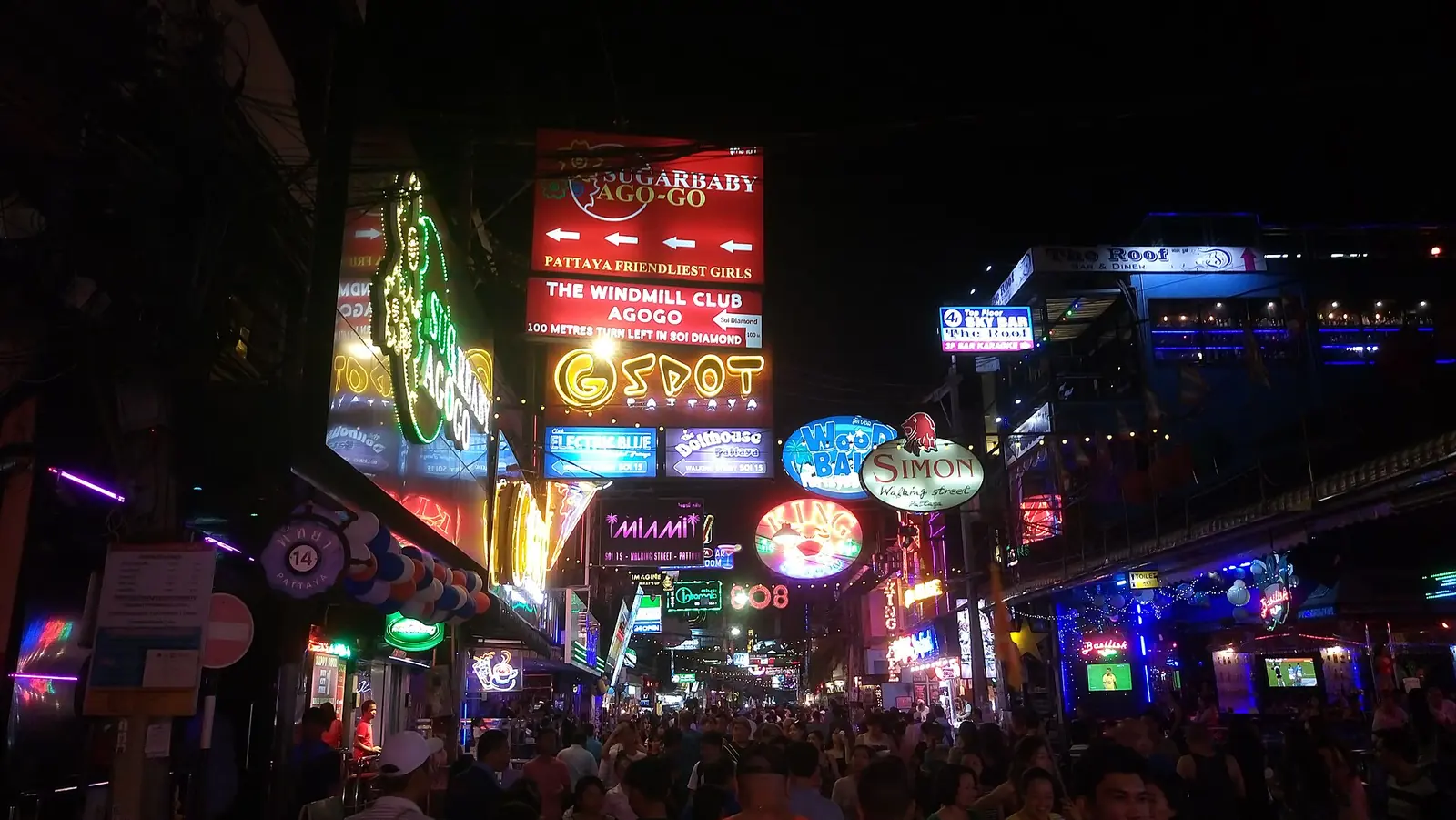 Walking Street Pattaya at night in June 2017, neon signs and pedestrians filling the street