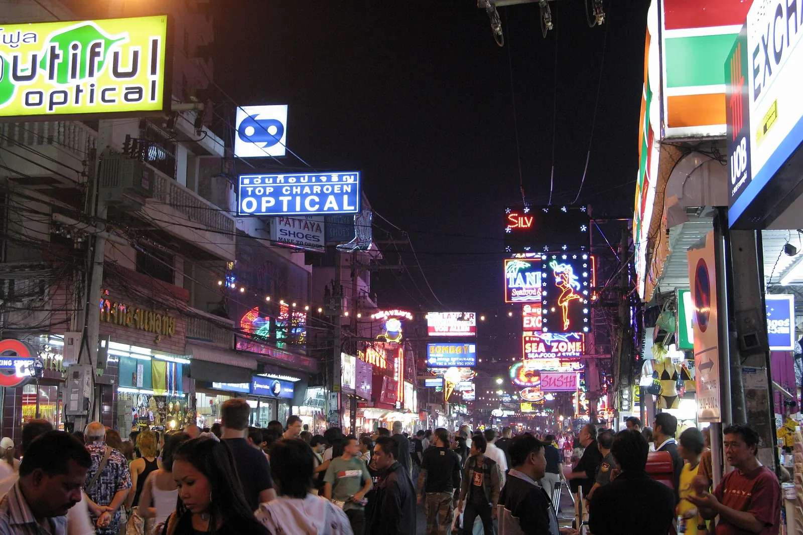 Walking Street Pattaya at night, with neon signs and a crowd filling the pedestrian street
