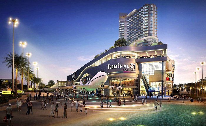 Terminal 21 Pattaya shopping mall exterior at night with aircraft-themed facade lit up